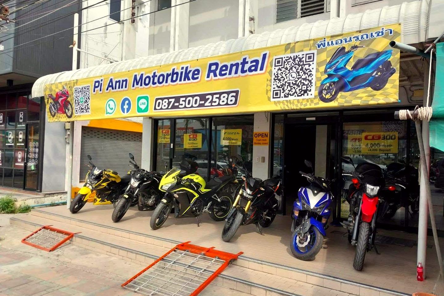 Pi Ann shop front with the yellow banner and bikes outside